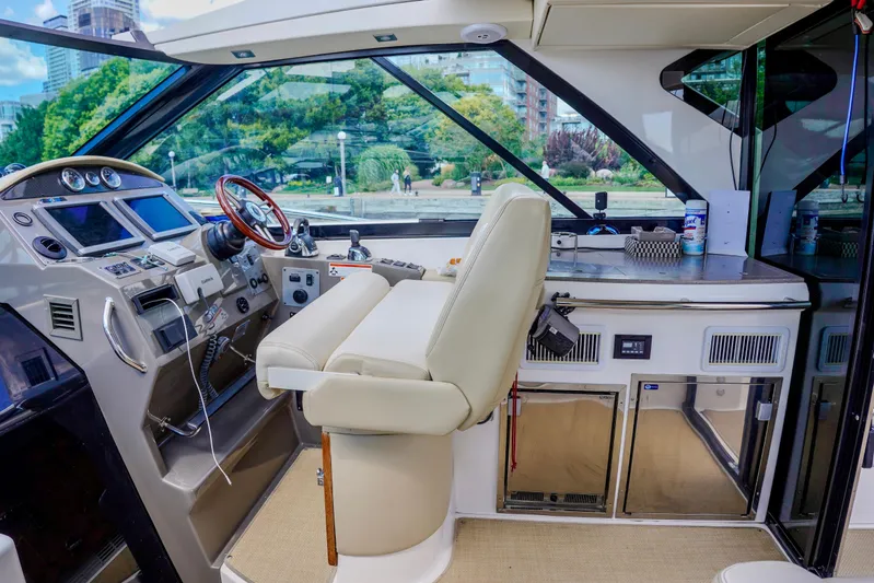  Yacht Photos Pics Interior of 2012 Regal 42 Sport Coupe yacht with modern helm and controls.