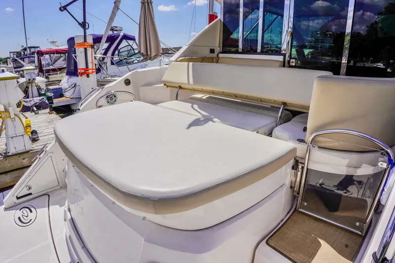  Yacht Photos Pics 2012 Regal 42 Sport Coupe yacht with spacious seating at a marina.