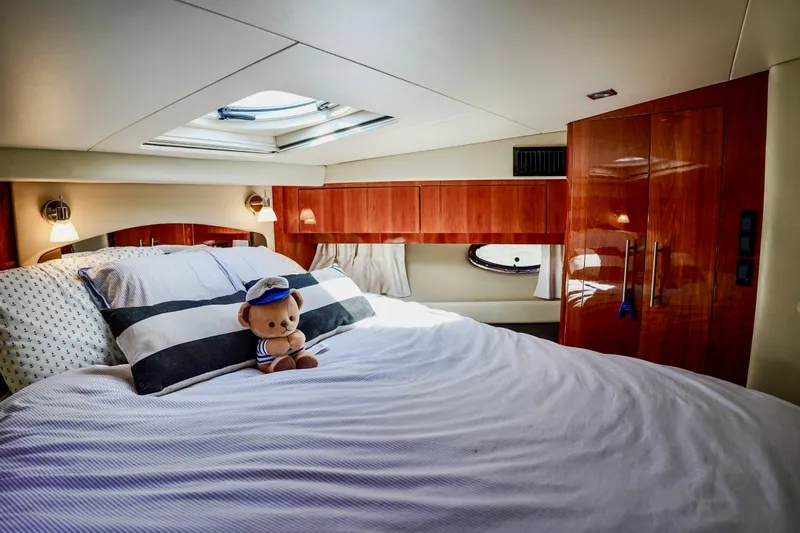  Yacht Photos Pics Luxurious bedroom interior of 2012 Regal 42 Sport Coupe yacht with plush bedding.