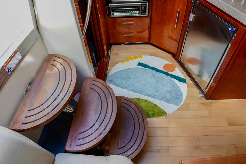  Yacht Photos Pics Interior of 2012 Regal 42 Sport Coupe with wooden steps and modern kitchen.