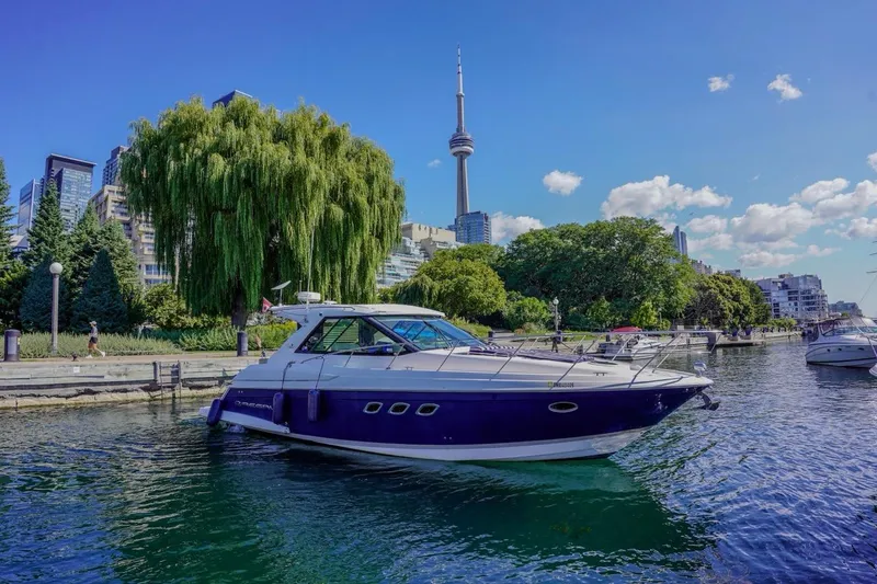 Yacht Photos Pics 2012 Regal 42 Sport Coupe yacht on water with city skyline and CN Tower backdrop.