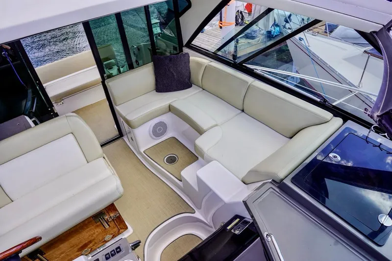  Yacht Photos Pics Luxurious interior of 2012 Regal 42 Sport Coupe yacht with plush seating.