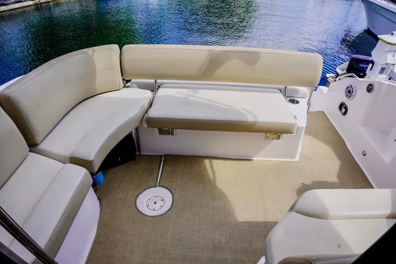  Yacht Photos Pics 2012 Regal 42 Sport Coupe interior with beige seating and water view.