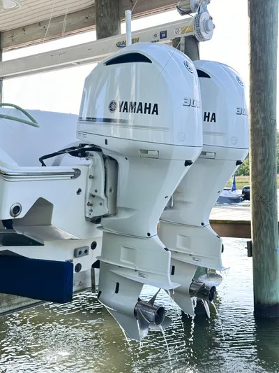  Yacht Photos Pics 2019 Jupiter 30 HFS with twin Yamaha outboard motors, docked in water.