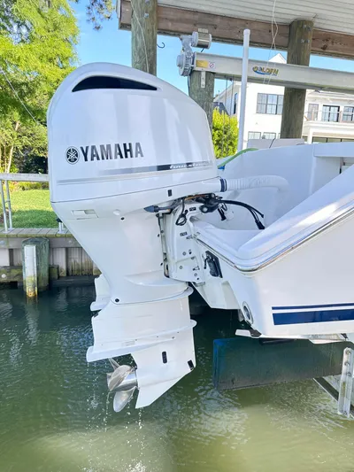  Yacht Photos Pics 2019 Jupiter 30 HFS boat with Yamaha outboard motor, docked in a marina.