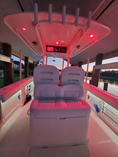  Yacht Photos Pics 2019 Jupiter 30 HFS boat interior with red LED lighting at sunset.