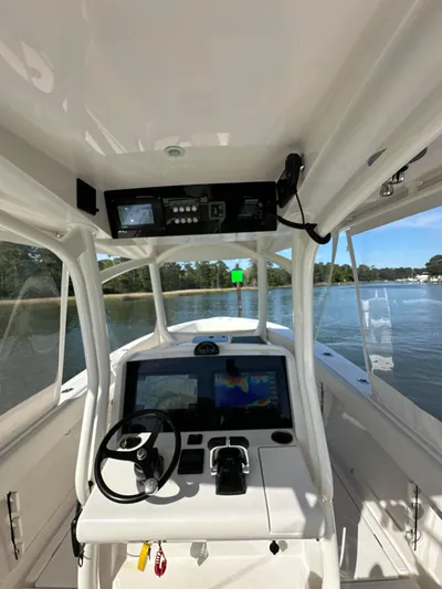  Yacht Photos Pics 2019 Jupiter 30 HFS boat cockpit with navigation system on calm water.
