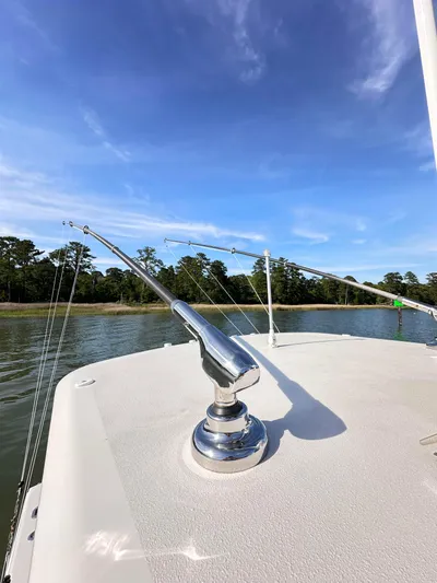  Yacht Photos Pics 2019 Jupiter 30 HFS boat deck with railing, calm water, and clear blue sky.