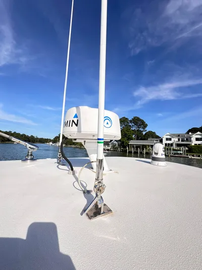  Yacht Photos Pics 2019 Jupiter 30 HFS boat deck with radar equipment under clear blue sky.