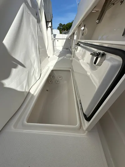  Yacht Photos Pics 2019 Jupiter 30 HFS boat storage compartment with open hatch, showcasing interior space.