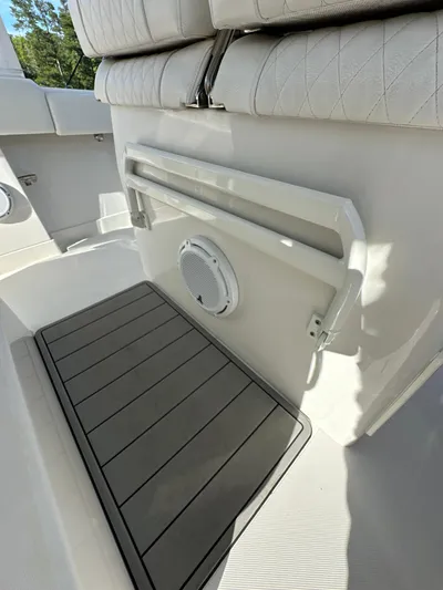  Yacht Photos Pics 2019 Jupiter 30 HFS boat interior with cushioned seating and deck details.