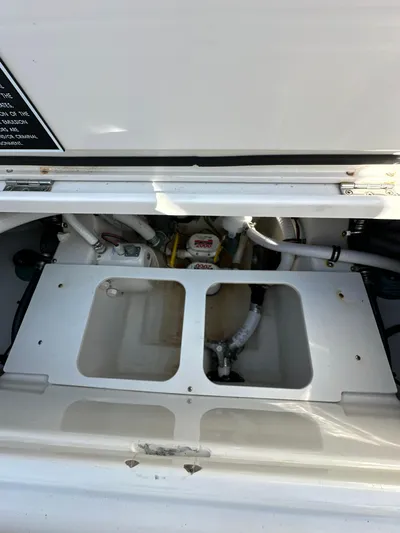  Yacht Photos Pics 2019 Jupiter 30 HFS boat compartment with visible plumbing and storage area.