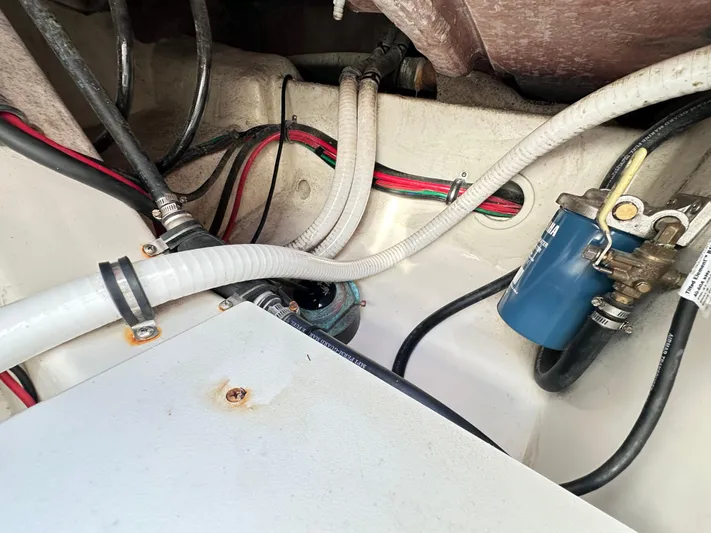  Yacht Photos Pics Engine compartment of a 2019 Jupiter 30 HFS boat with visible hoses and wiring.
