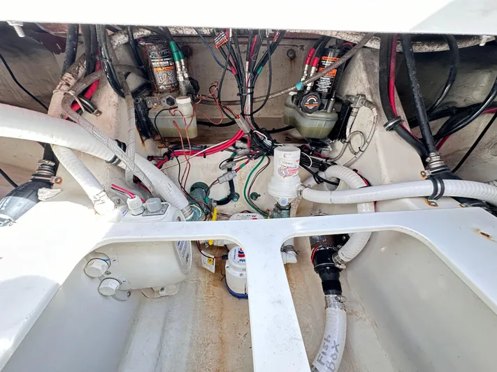  Yacht Photos Pics Engine compartment of a 2019 Jupiter 30 HFS boat, showing wiring and hoses.
