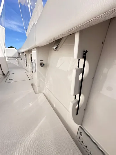  Yacht Photos Pics 2019 Jupiter 30 HFS boat interior with sleek white design and storage compartments.