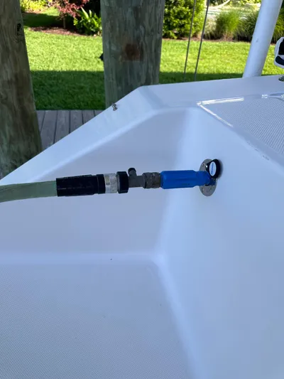  Yacht Photos Pics Hose connected to a 2019 Jupiter 30 HFS boat on a sunny day.