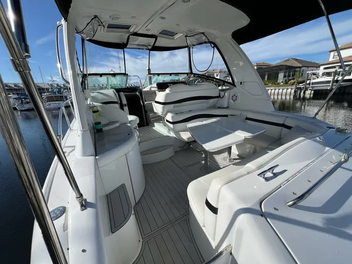 Happy Ours Yacht Photos Pics 2005 Formula 40 PC yacht interior with spacious seating and modern design at a marina.