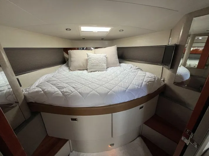 Happy Ours Yacht Photos Pics Luxurious cabin interior of a 2005 Formula 40 PC yacht with cozy bedding.