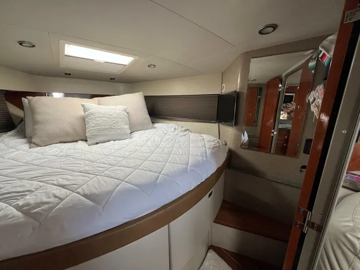 Happy Ours Yacht Photos Pics Luxurious interior of 2005 Formula 40 PC yacht with cozy bed and modern design.