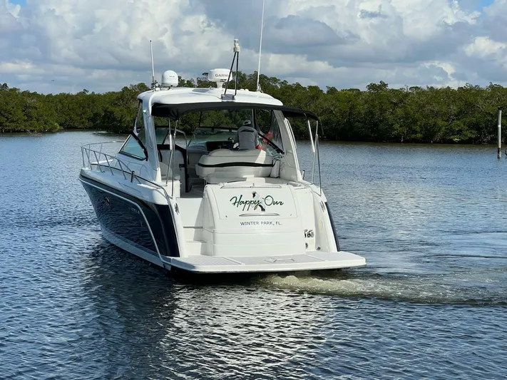 Happy Ours Yacht Photos Pics 2005 Formula 40 PC yacht cruising on calm waters under a cloudy sky.
