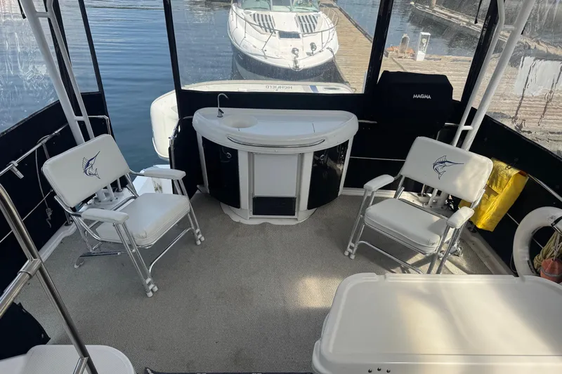 Lost Together Yacht Photos Pics 1996 Bayliner 4087 Aft Cabin Motoryacht interior with seating and kitchenette, docked at marina.