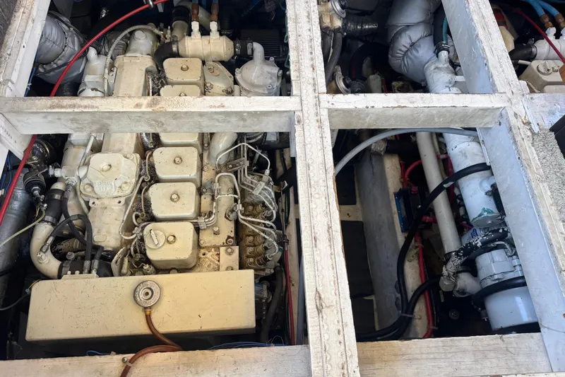 Lost Together Yacht Photos Pics Engine compartment of a 1996 Bayliner 4087 Aft Cabin Motoryacht, showcasing mechanical components.