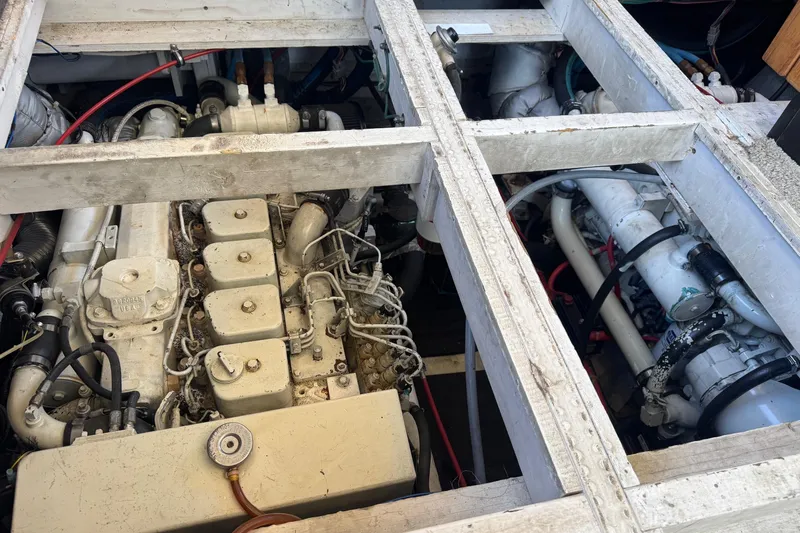 Lost Together Yacht Photos Pics Engine compartment of a 1996 Bayliner 4087 Aft Cabin Motoryacht, showcasing dual engines.