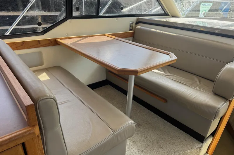 Lost Together Yacht Photos Pics 1996 Bayliner 4087 Aft Cabin Motoryacht interior with dining area and leather seating.