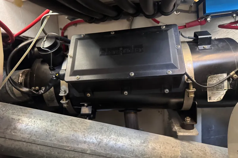 Lost Together Yacht Photos Pics Engine compartment of a 1996 Bayliner 4087 Aft Cabin Motoryacht, featuring mechanical components.