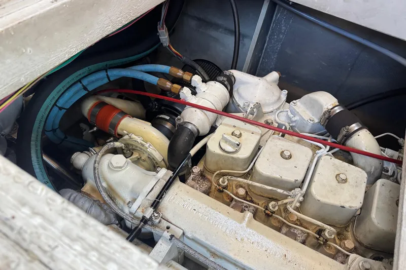 Lost Together Yacht Photos Pics Engine compartment of a 1996 Bayliner 4087 Aft Cabin Motoryacht, showing mechanical components.