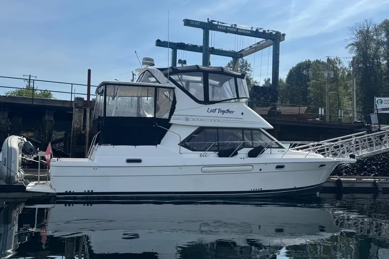 Lost Together Yacht Photos Pics 1996 Bayliner 4087 Aft Cabin Motoryacht docked at marina, side view.