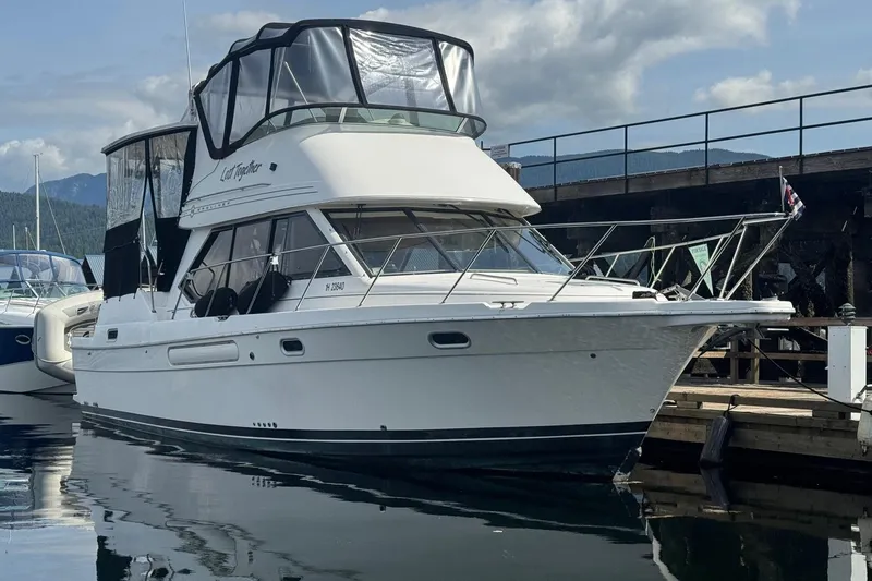 Lost Together Yacht Photos Pics 1996 Bayliner 4087 Aft Cabin Motoryacht docked at marina, clear sky background.