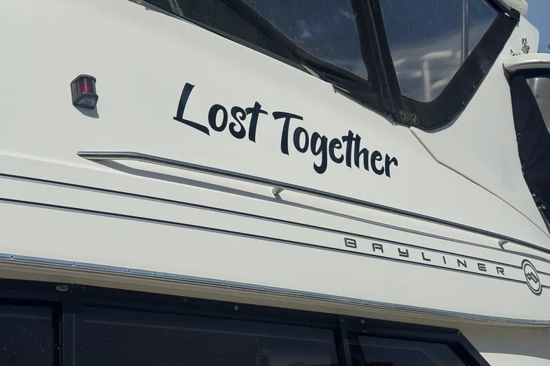 Lost Together Yacht Photos Pics 1996 Bayliner 4087 Aft Cabin Motoryacht with "Lost Together" name on the side.