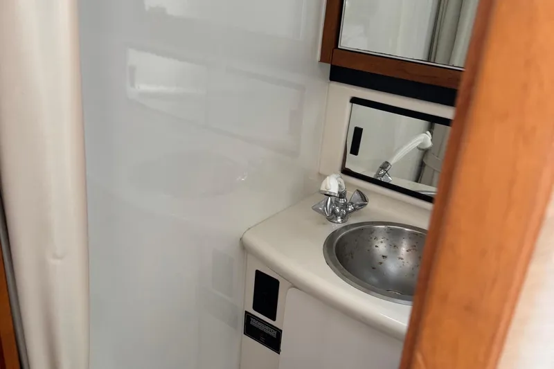 Lost Together Yacht Photos Pics 1996 Bayliner 4087 Aft Cabin Motoryacht bathroom with sink and mirror.