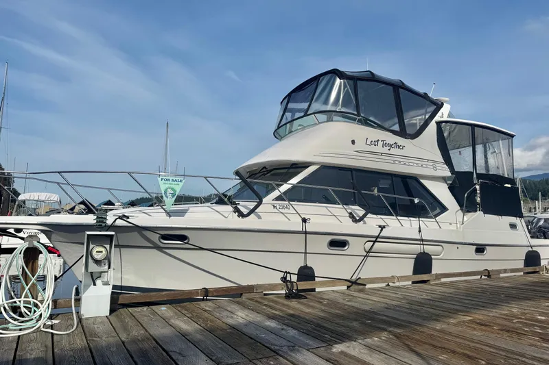 Lost Together Yacht Photos Pics 1996 Bayliner 4087 Aft Cabin Motoryacht docked, for sale sign visible.