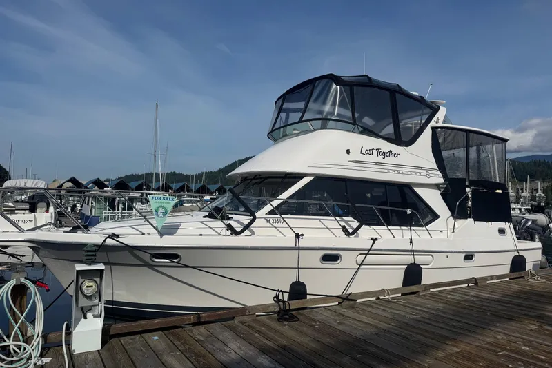 Lost Together Yacht Photos Pics 1996 Bayliner 4087 Aft Cabin Motoryacht docked, for sale, with clear skies.