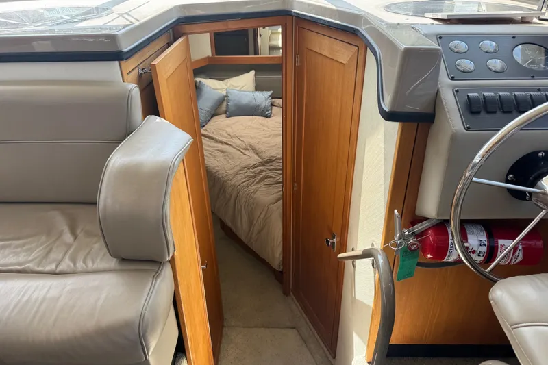 Lost Together Yacht Photos Pics 1996 Bayliner 4087 Aft Cabin Motoryacht interior with helm, seating, and cabin entrance.