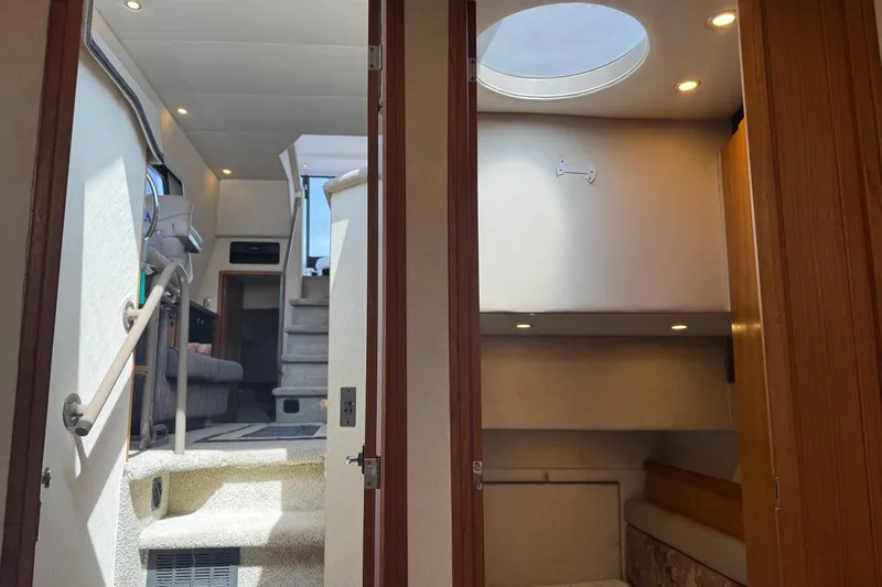 Lost Together Yacht Photos Pics Interior view of 1996 Bayliner 4087 Aft Cabin Motoryacht, featuring stairs and cozy cabin space.