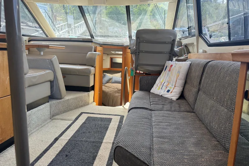 Lost Together Yacht Photos Pics 1996 Bayliner 4087 Aft Cabin Motoryacht interior with seating, helm, and cabin view.