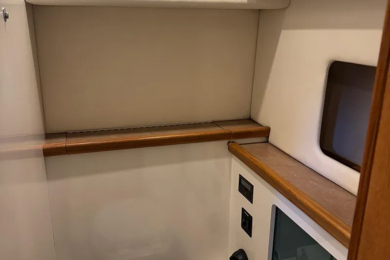 Lost Together Yacht Photos Pics Interior of 1996 Bayliner 4087 Aft Cabin Motoryacht with wood trim and electrical panel.