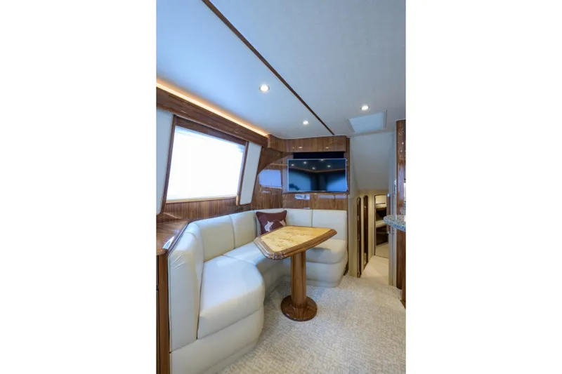 Andiamo Yacht Photos Pics Luxurious interior of 2017 Viking 48 Convertible yacht with plush seating and elegant wood finishes.