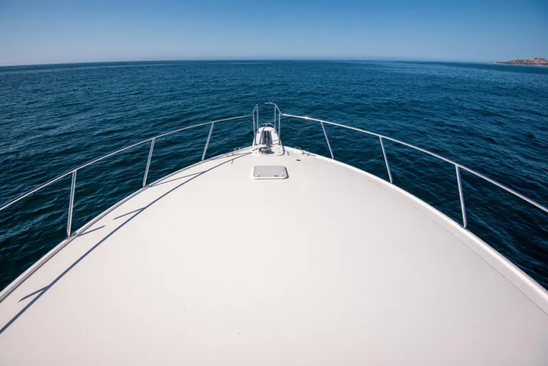 Andiamo Yacht Photos Pics Bow view of 2017 Viking 48 Convertible yacht on open sea.