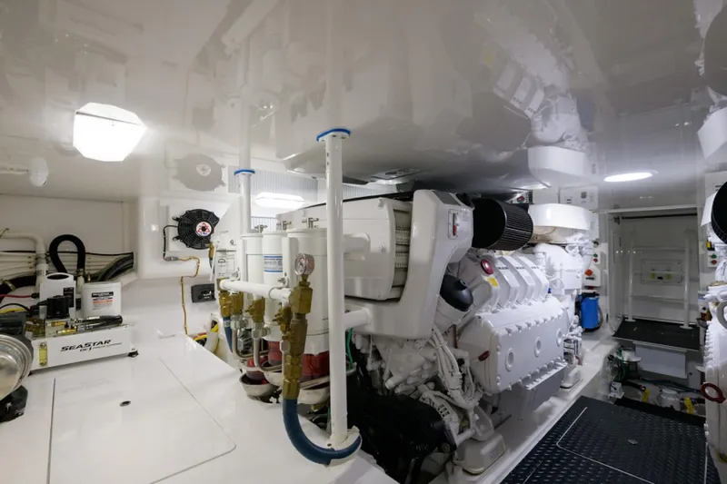 Andiamo Yacht Photos Pics Engine room of 2017 Viking 48 Convertible yacht, showcasing machinery and equipment.