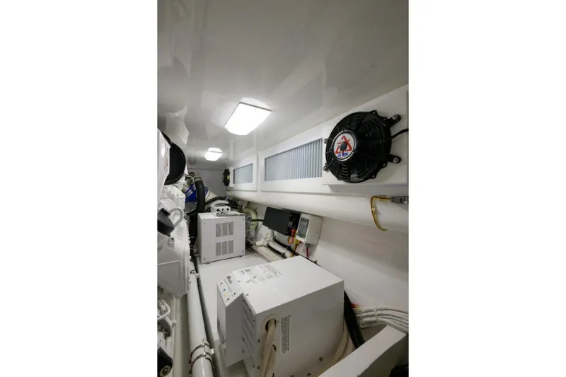 Andiamo Yacht Photos Pics Engine room of 2017 Viking 48 Convertible yacht, featuring equipment and ventilation system.