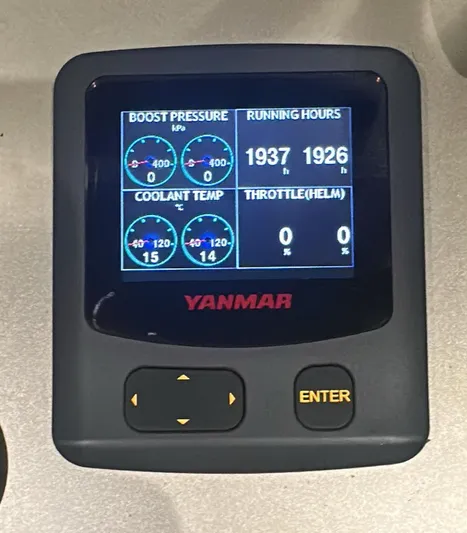 Dolphin Yacht Photos Pics Yanmar engine display showing boost pressure, running hours, coolant temperature, and throttle for Sunreef 50.