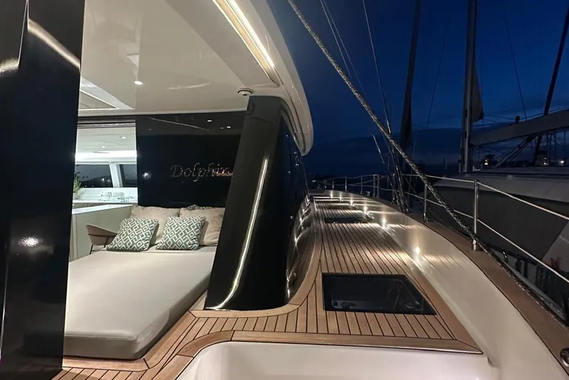 Dolphin Yacht Photos Pics Luxurious 2019 Sunreef 50 yacht deck at night, featuring elegant lighting and comfortable seating.