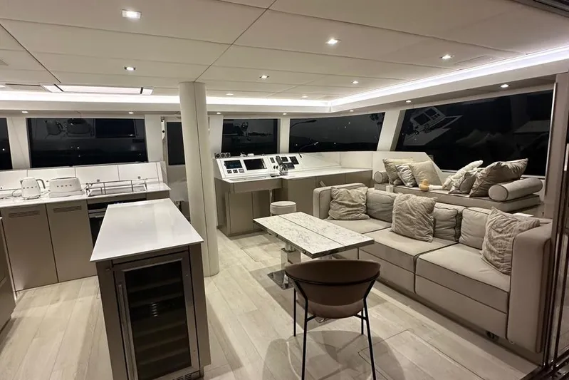 Dolphin Yacht Photos Pics Luxurious interior of a 2019 Sunreef 50 yacht with modern furnishings and elegant design.