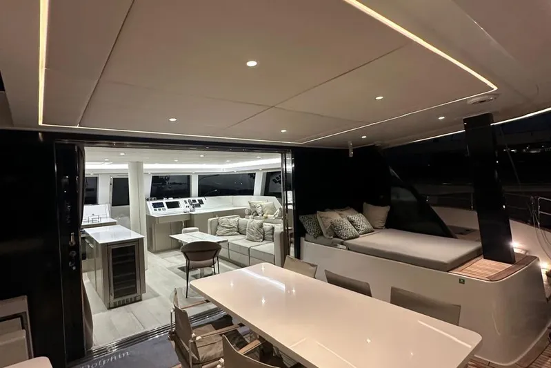 Dolphin Yacht Photos Pics Luxurious interior of 2019 Sunreef 50 yacht with modern seating and dining area.