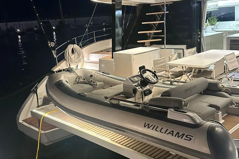 Dolphin Yacht Photos Pics Luxurious 2019 Sunreef 50 yacht with Williams Sportjet tender at night.