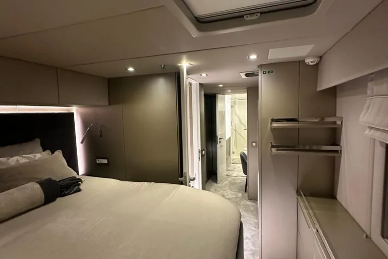Dolphin Yacht Photos Pics Luxurious interior of 2019 Sunreef 50 yacht, featuring a cozy bedroom and modern design.